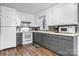 Efficient kitchen featuring white cabinets, modern appliances, and laminate floors at 1266 18Th Ne St, Hickory, NC 28601