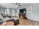 Comfortable living room with gray sofa, wood-look flooring and ceiling fan at 1266 18Th Ne St, Hickory, NC 28601