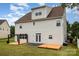Back exterior featuring a cozy outdoor space and manicured backyard, perfect for relaxation and entertaining at 13305 Mallard Landing Rd, Charlotte, NC 28278