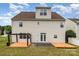 Backyard view showcasing a spacious lawn and a wooden deck with a pergola at 13305 Mallard Landing Rd, Charlotte, NC 28278
