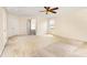 Spacious bedroom featuring large windows, carpet floors, and ceiling fan at 13305 Mallard Landing Rd, Charlotte, NC 28278