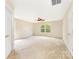 Generous bedroom boasts a ceiling fan, carpet floors, and ample natural light at 13305 Mallard Landing Rd, Charlotte, NC 28278