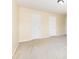 Bedroom with carpet floors, white trim, with paneled doors at 13305 Mallard Landing Rd, Charlotte, NC 28278