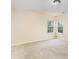 Well-lit bedroom with carpet floors, two windows overlooking greenery at 13305 Mallard Landing Rd, Charlotte, NC 28278