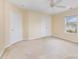 Bright bedroom with double closets, a window, and carpeted flooring at 13305 Mallard Landing Rd, Charlotte, NC 28278