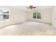 Sun-filled bedroom with carpet floors, windows providing a view at 13305 Mallard Landing Rd, Charlotte, NC 28278