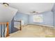 Bonus room featuring carpet, natural light, and stairs leading to the upper level at 13305 Mallard Landing Rd, Charlotte, NC 28278