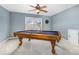 Carpeted game room with a ceiling fan and window featuring a pool table at 13305 Mallard Landing Rd, Charlotte, NC 28278