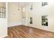 Inviting living room with hardwood floors, large windows, and plenty of natural light at 13305 Mallard Landing Rd, Charlotte, NC 28278
