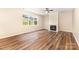 Bright living room features a fireplace, ceiling fan, and large window offering lots of natural light at 13305 Mallard Landing Rd, Charlotte, NC 28278