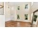 Bright living room with hardwood floors, high ceilings, and expansive windows providing natural light at 13305 Mallard Landing Rd, Charlotte, NC 28278