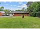 Expansive backyard featuring a well-maintained lawn and exterior view of the home at 1344 Shannonhouse Dr, Charlotte, NC 28215
