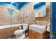 Modern bathroom featuring a tiled shower, square sink, and sleek fixtures at 1344 Shannonhouse Dr, Charlotte, NC 28215