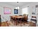 Inviting dining room with hardwood floors, modern lighting, and stylish decor create a perfect setting for gatherings at 1344 Shannonhouse Dr, Charlotte, NC 28215