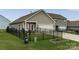 Fenced backyard with a covered patio and well-maintained lawn at 148 Kerri Dawn Ln, Locust, NC 28097