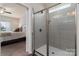 Modern bathroom showcasing a glass-enclosed shower with sleek, gray tiling at 148 Kerri Dawn Ln, Locust, NC 28097