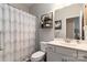 Cozy bathroom featuring a stylish shower curtain, decor, and a single vanity at 148 Kerri Dawn Ln, Locust, NC 28097