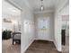 Well-lit entryway with hardwood floors and convenient coat hooks at 148 Kerri Dawn Ln, Locust, NC 28097
