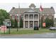 View of Locust Government Center featuring classic architecture and well-kept grounds at 148 Kerri Dawn Ln, Locust, NC 28097