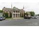 Front exterior of a municipal building with stately columns and well-manicured landscaping at 148 Kerri Dawn Ln, Locust, NC 28097