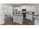 Modern kitchen with white cabinets, granite countertops, and stainless steel appliances at 148 Kerri Dawn Ln, Locust, NC 28097