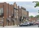 Locust street view featuring brick buildings with awnings and street parking at 148 Kerri Dawn Ln, Locust, NC 28097
