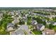 Aerial view of a residential neighborhood showcasing neatly arranged homes and lush greenery at 1522 Napa Nw St, Concord, NC 28027