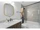 Cozy bathroom features a stylish vanity, framed mirror, shower-tub, and updated fixtures at 1522 Napa Nw St, Concord, NC 28027
