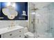 Stylish bathroom featuring a vanity, gold fixtures, and a glass-enclosed shower with marble-like tiling at 1522 Napa Nw St, Concord, NC 28027