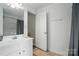 Bright bathroom features a single sink vanity, mirror, and a shower/tub combo at 1522 Napa Nw St, Concord, NC 28027
