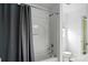 Bathroom showcasing a shower-tub combo with a gray shower curtain at 1522 Napa Nw St, Concord, NC 28027