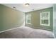 Comfortable bedroom with two windows dressed with blinds allowing natural light at 1522 Napa Nw St, Concord, NC 28027