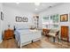 Well-lit bedroom featuring a bed, decor, and large windows, offering a tranquil space for relaxation at 1522 Napa Nw St, Concord, NC 28027