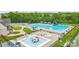 The aerial view features multiple pools, a water slide, and a splash pad for Gathering fun at 1522 Napa Nw St, Concord, NC 28027