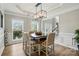 Dining area features hardwood floors, natural light, a decorative chandelier, and modern decor at 1522 Napa Nw St, Concord, NC 28027