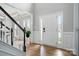 Bright entryway with hardwood floors, white trim, and a large front door with sidelights at 1522 Napa Nw St, Concord, NC 28027