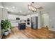 Modern kitchen with white cabinets, stainless steel appliances, and a stylish island with seating at 1522 Napa Nw St, Concord, NC 28027