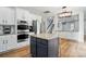 A kitchen island provides extra workspace and seating in this modern, well-equipped kitchen at 1522 Napa Nw St, Concord, NC 28027