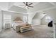 Spacious main bedroom with tray ceilings, a ceiling fan, ensuite bathroom access, and large windows at 1522 Napa Nw St, Concord, NC 28027