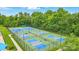 Aerial view of the multiple well-maintained community tennis courts for active residents at 1522 Napa Nw St, Concord, NC 28027