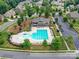 Aerial shot showcasing the community pool and clubhouse with surrounding landscaping and residential area at 200 Sweet Briar Dr, Fort Mill, SC 29707