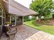 Cozy covered back patio with brick pavers, perfect for outdoor seating and relaxation with a retractable awning at 200 Sweet Briar Dr, Fort Mill, SC 29707