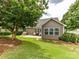 Backyard featuring a lovely stone patio perfect for outdoor entertaining and relaxing in a peaceful setting at 200 Sweet Briar Dr, Fort Mill, SC 29707