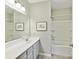 Bathroom with tile flooring, single sink vanity with chrome hardware and bathtub and shower combo at 200 Sweet Briar Dr, Fort Mill, SC 29707
