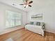 Bedroom featuring hardwood floors, a daybed and natural light from the bright window at 200 Sweet Briar Dr, Fort Mill, SC 29707