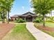 Community clubhouse featuring a stone facade, covered porch, and well-manicured landscaping at 200 Sweet Briar Dr, Fort Mill, SC 29707
