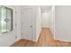 Bright entryway hallway with hardwood floors and white doors for a clean, modern look at 200 Sweet Briar Dr, Fort Mill, SC 29707