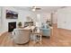 Bright living room with a fireplace, hardwood floors, comfortable seating, and stylish decor at 200 Sweet Briar Dr, Fort Mill, SC 29707