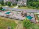 Community playground with swings, slides, and climbing structures, perfect for Gathering fun and outdoor activities at 200 Sweet Briar Dr, Fort Mill, SC 29707