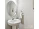 Powder room with white vanity and mirror at 200 Sweet Briar Dr, Fort Mill, SC 29707